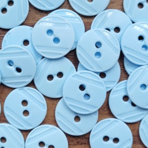 Guziki 24- niebieskie 15 mm.